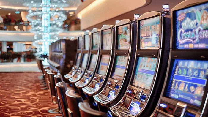 Filipino player browsing Vegas Slots game lobby on mobile phone